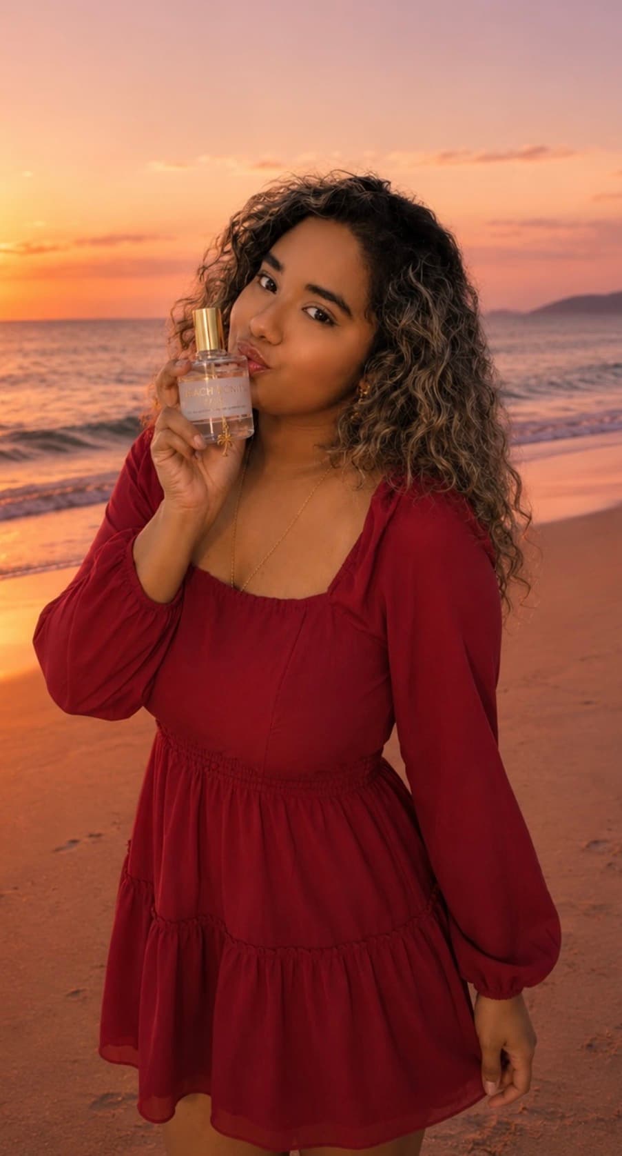 Founder Bhanuja Bakthavaksalan holding Beach Bonita on the beach at sunset